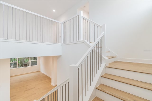 stairway featuring hardwood / wood-style floors