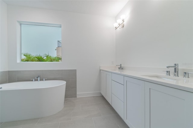 bathroom with tile patterned flooring, a bath, vanity, and tile walls