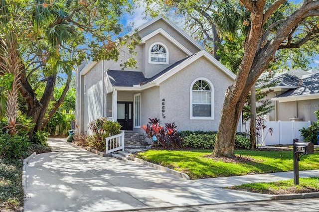 view of front of property with a front lawn