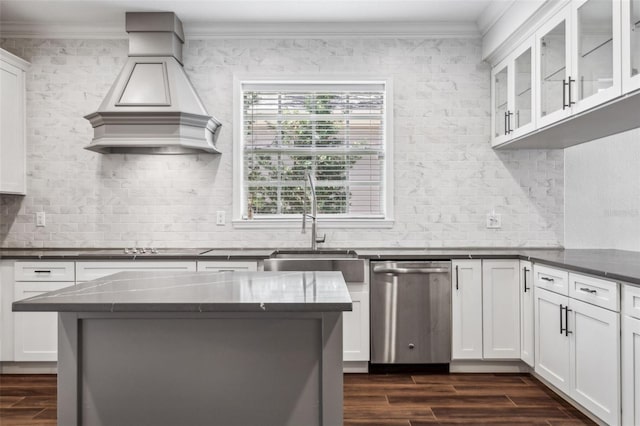 kitchen with white cabinetry, dishwasher, premium range hood, and dark hardwood / wood-style flooring