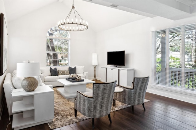 living room featuring dark hardwood / wood-style flooring, lofted ceiling, a chandelier, and a healthy amount of sunlight