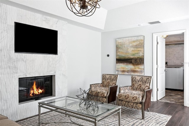 living room with wood-type flooring and a chandelier