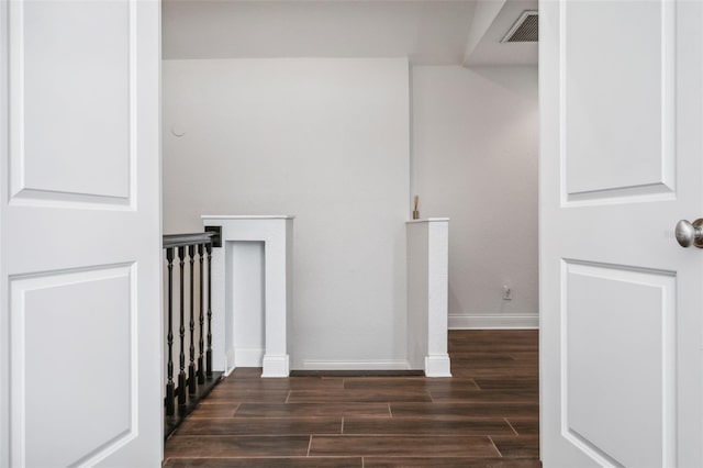 hall with dark wood-type flooring