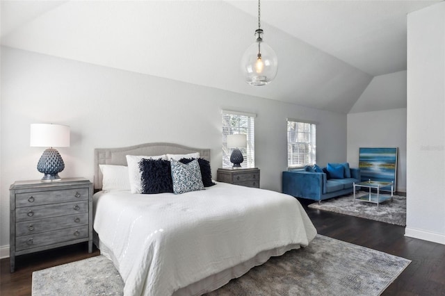 bedroom featuring lofted ceiling and dark hardwood / wood-style flooring