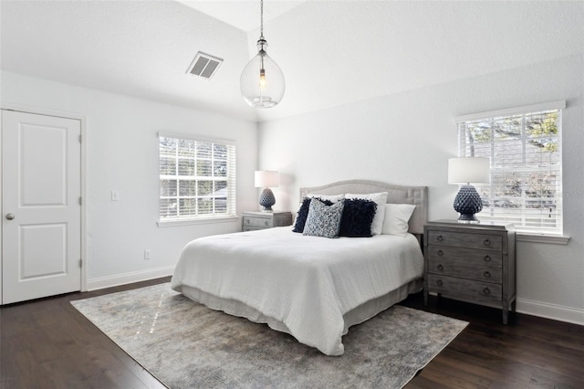 bedroom featuring dark hardwood / wood-style flooring