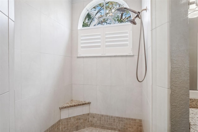 bathroom featuring tiled shower