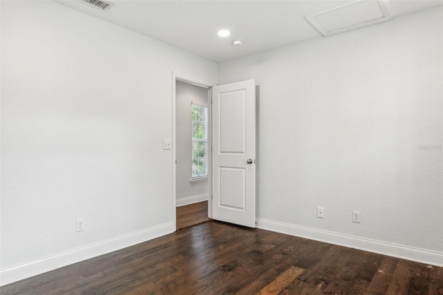 empty room featuring dark hardwood / wood-style floors