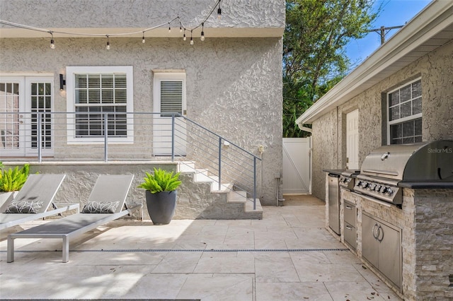 view of patio featuring exterior kitchen and grilling area