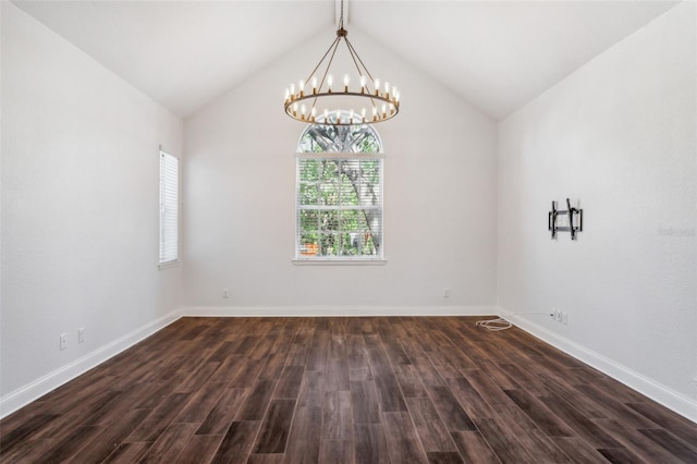 spare room with vaulted ceiling with beams and dark hardwood / wood-style flooring