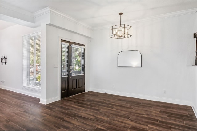 entrance foyer featuring crown molding, dark hardwood / wood-style floors, and a chandelier