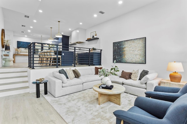 living room with light hardwood / wood-style flooring