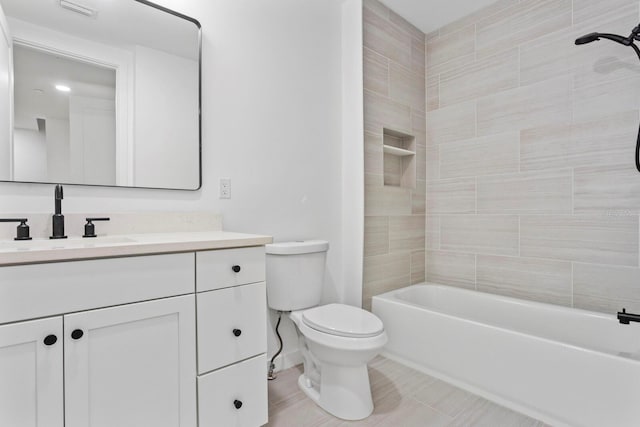 full bathroom with tile patterned flooring, vanity, toilet, and tiled shower / bath combo