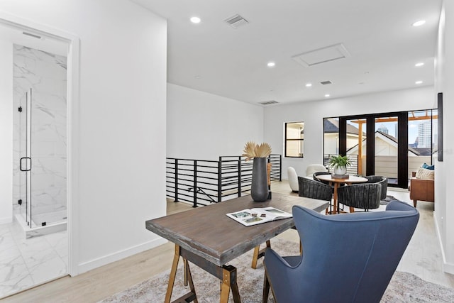 office area with light hardwood / wood-style flooring