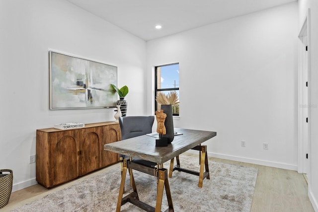 office with light hardwood / wood-style floors