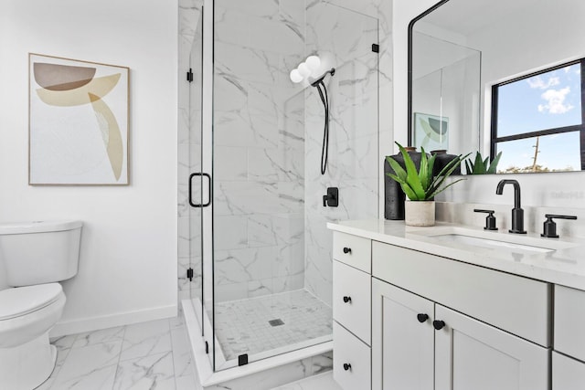 bathroom with vanity, an enclosed shower, and toilet