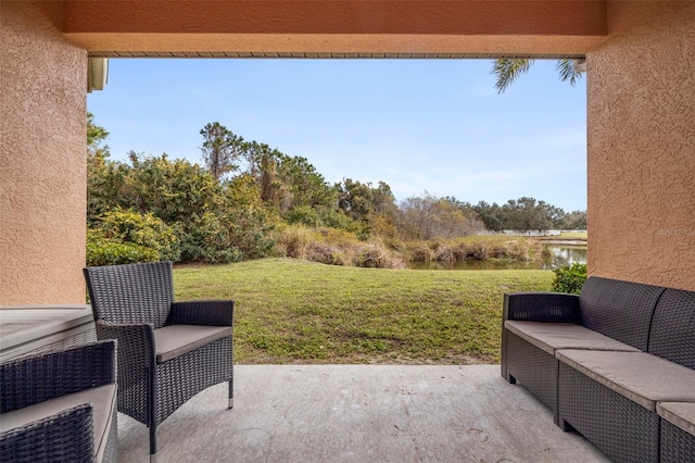 view of patio featuring a water view