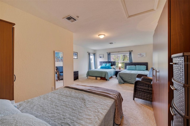 carpeted bedroom featuring a textured ceiling