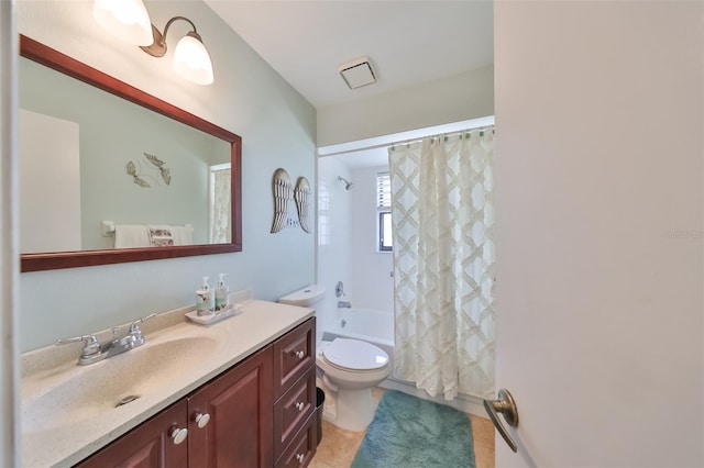 full bathroom with tile patterned flooring, shower / bath combo, vanity, and toilet