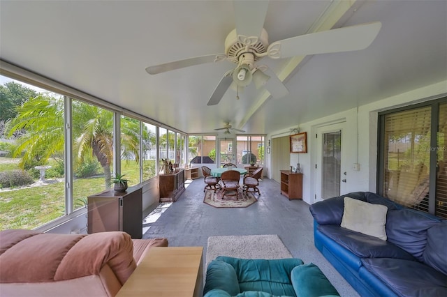 sunroom featuring vaulted ceiling and ceiling fan