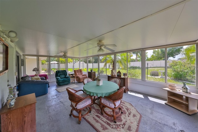 sunroom featuring ceiling fan