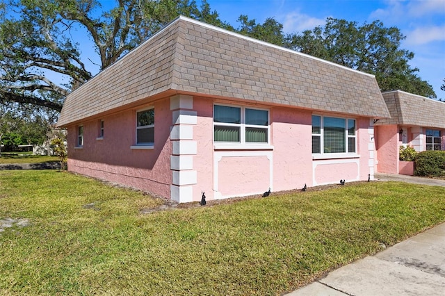 view of home's exterior featuring a lawn