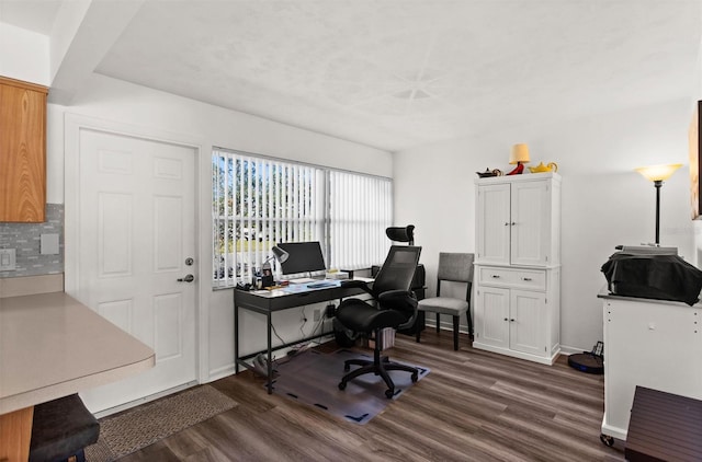 home office with baseboards and dark wood-style flooring