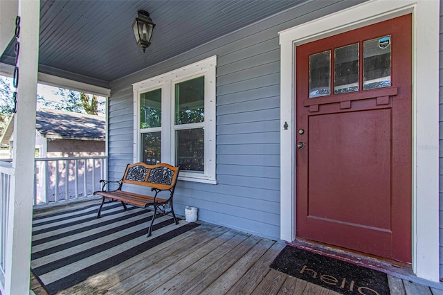 property entrance featuring covered porch