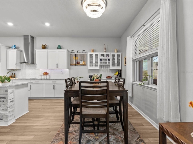 dining room with a chandelier and light hardwood / wood-style floors