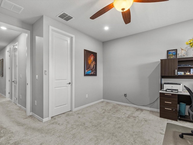 home office featuring ceiling fan and light carpet