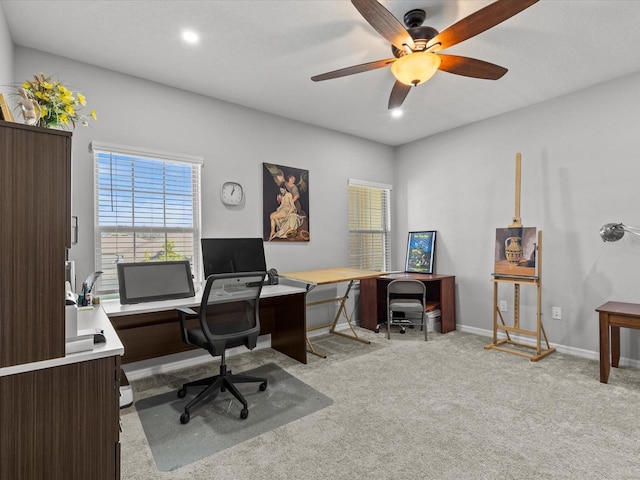 carpeted office with ceiling fan