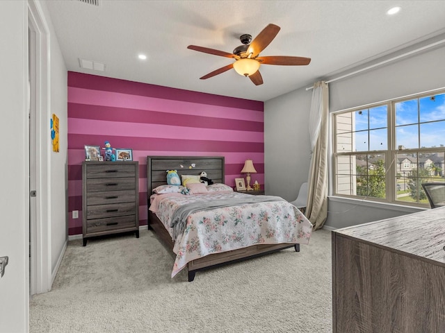 bedroom featuring ceiling fan and light colored carpet