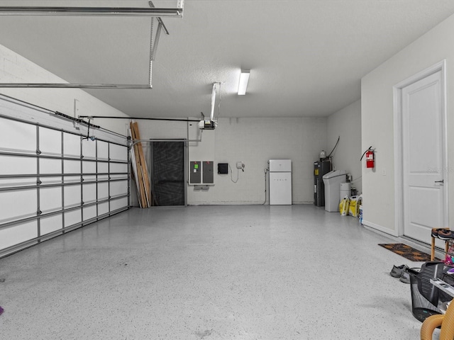 garage with white refrigerator, electric water heater, and a garage door opener