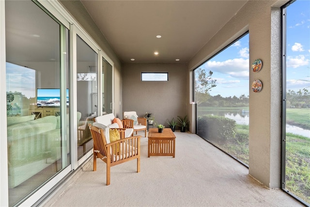 sunroom with a water view