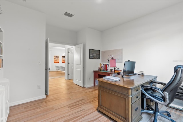 office space with light wood-type flooring