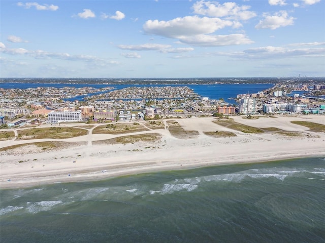 drone / aerial view featuring a view of the beach and a water view