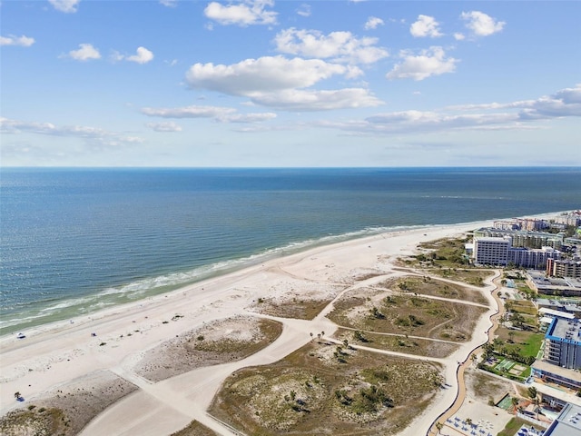 bird's eye view featuring a view of the beach and a water view