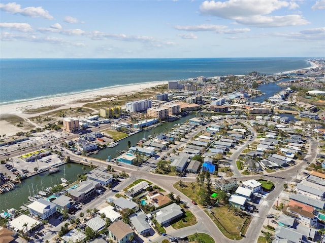 bird's eye view with a water view and a view of the beach