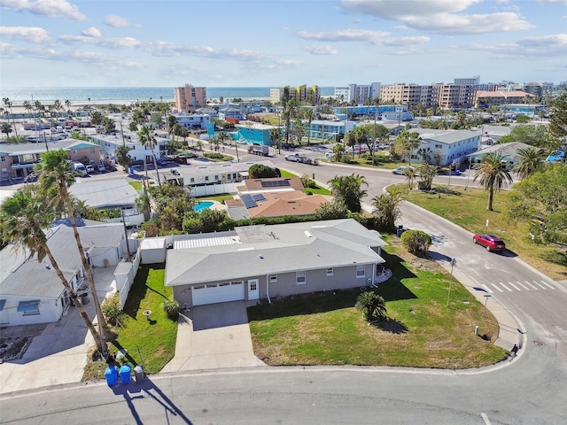 drone / aerial view featuring a view of city and a water view