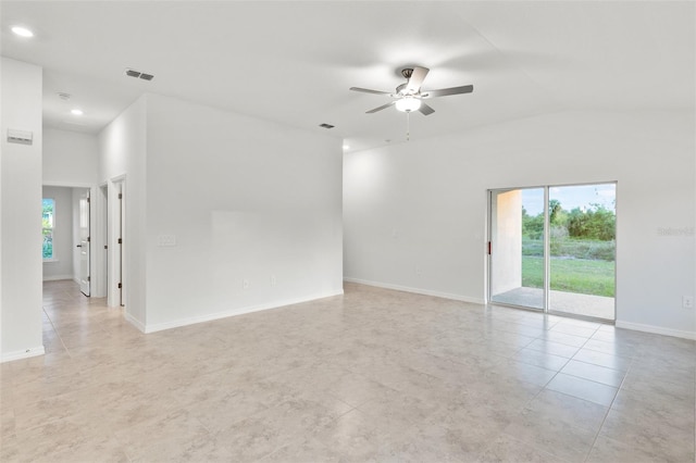 tiled spare room with ceiling fan