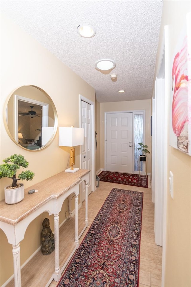 corridor with a textured ceiling