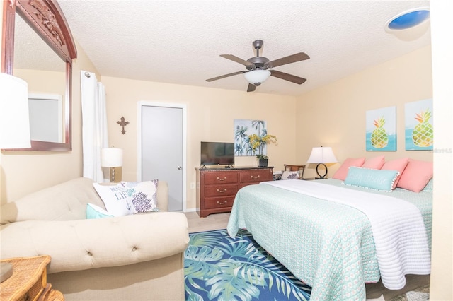 bedroom featuring a textured ceiling and ceiling fan