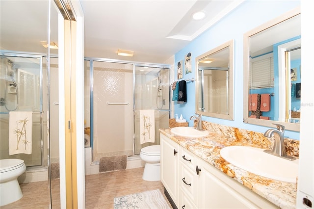 bathroom featuring an enclosed shower, vanity, hardwood / wood-style flooring, and toilet