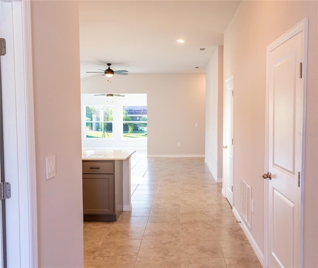 corridor with light tile patterned flooring