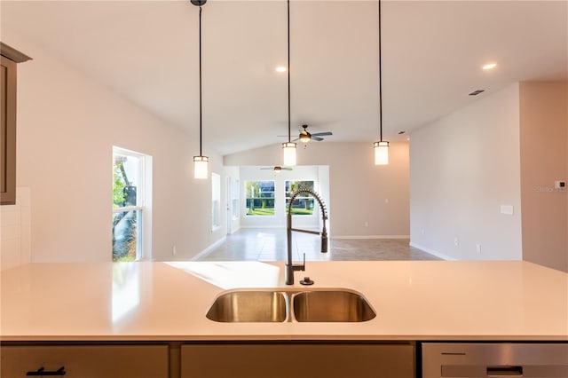 kitchen with stainless steel dishwasher, ceiling fan, sink, light tile patterned floors, and lofted ceiling