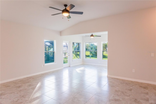 tiled spare room with ceiling fan and lofted ceiling