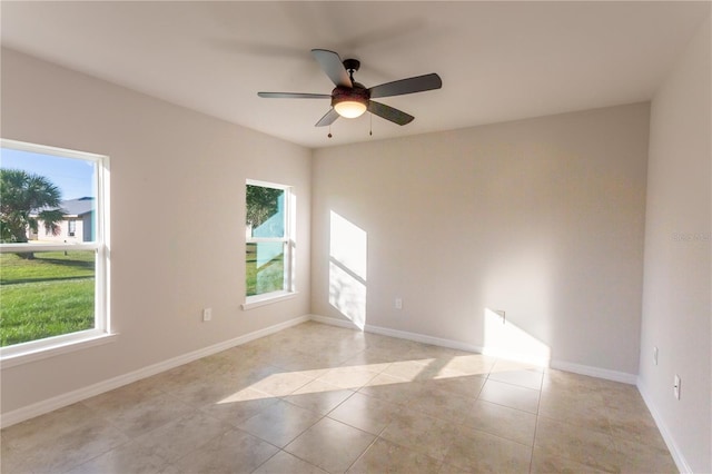 133 Angol St, Punta Gorda, FL 33983 - empty room featuring baseboards, ceiling fan, and light tile patterned flooring