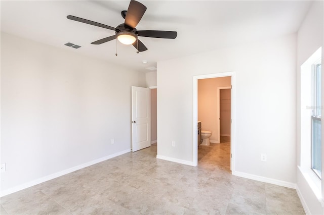 unfurnished bedroom featuring ceiling fan and ensuite bathroom