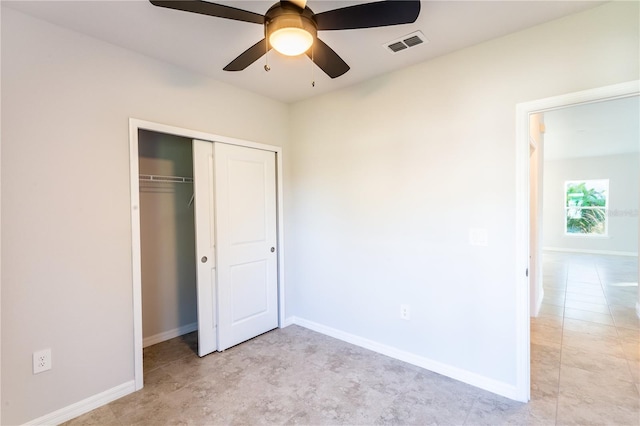 unfurnished bedroom with a closet and ceiling fan