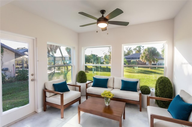 sunroom featuring ceiling fan