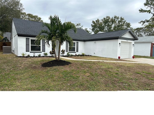 single story home featuring a front lawn, a garage, and cooling unit